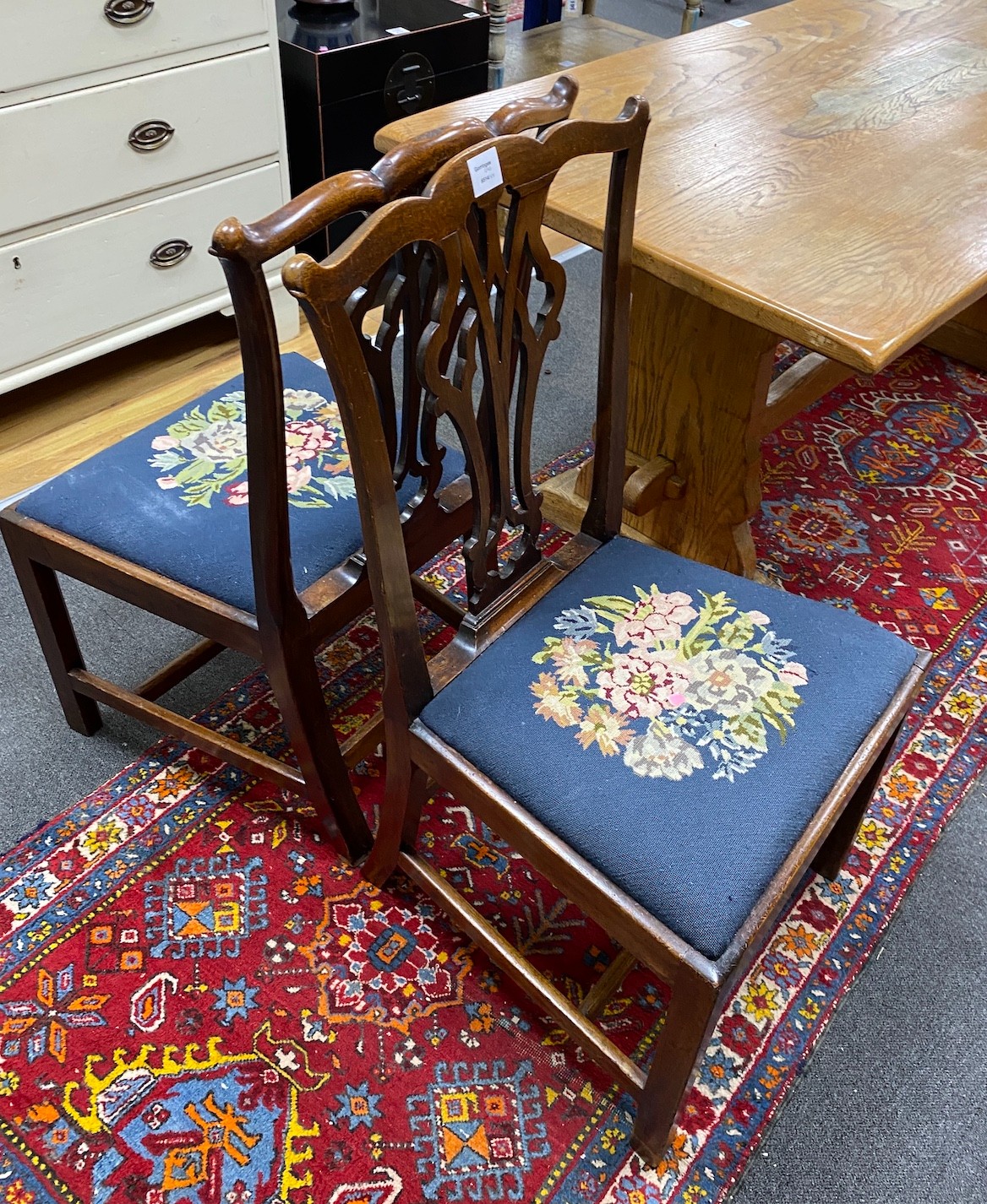 A pair of George III mahogany dining chairs with tapestry seats